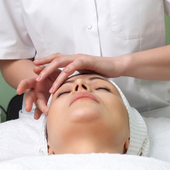 applying facial massage in the beauty salon